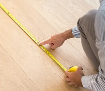 Man Measuring | Kelly's Carpet & Furniture