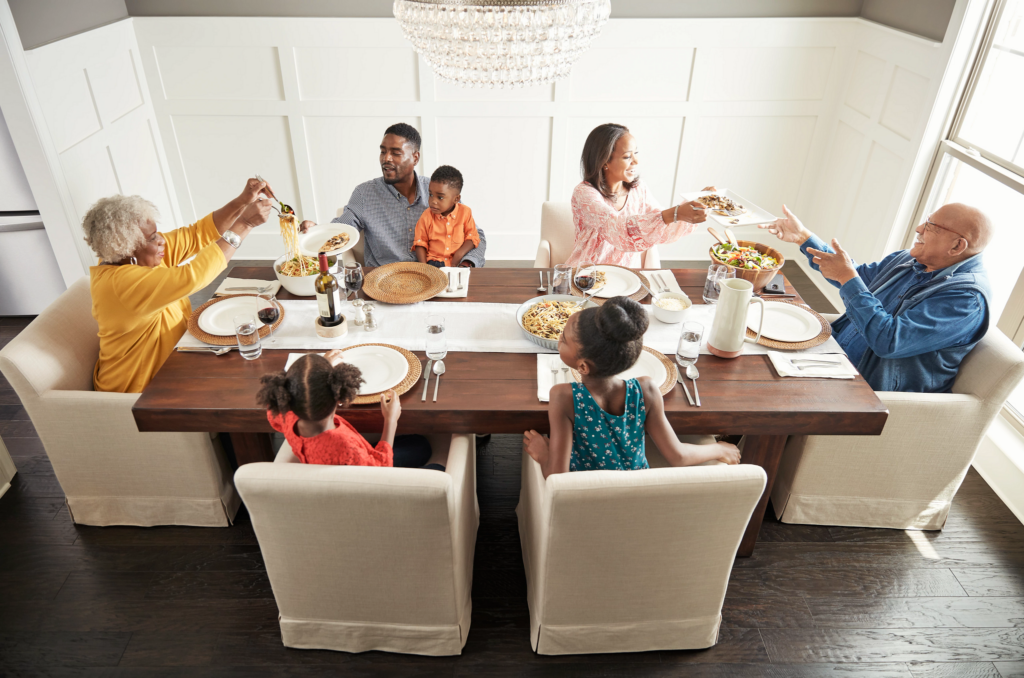 Happy family enjoying breakfast | Kelly's Carpet & Furniture